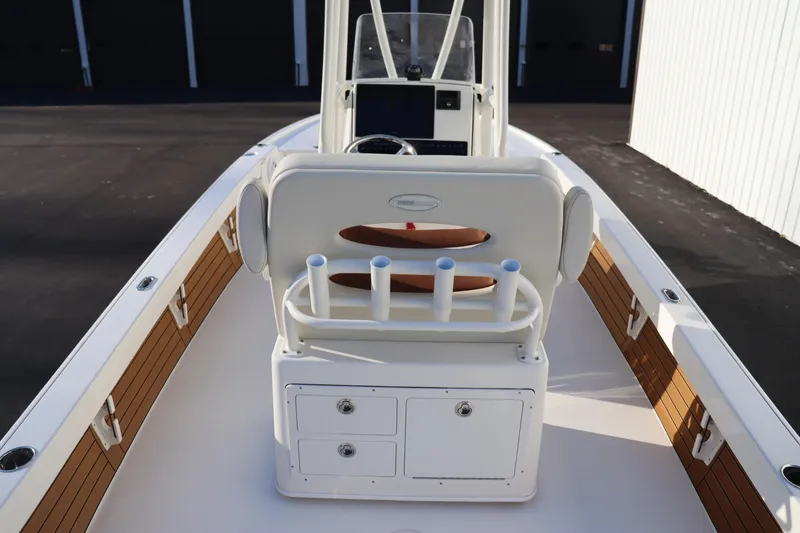 Slide: The Image of 2024 Pathfinder 2500 Hybrid boat interior with rod holders and storage compartments. - 25