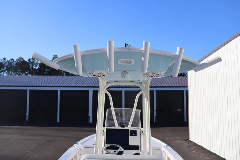 Slide: The Image of 2024 Pathfinder 2500 Hybrid boat with T-top and rod holders. - 26