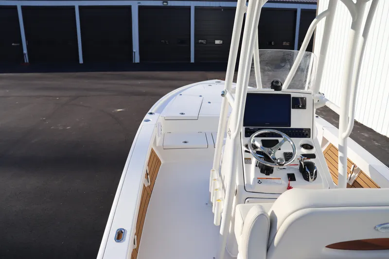 Slide: The Image of 2024 Pathfinder 2500 Hybrid boat interior with console and seating. - 28