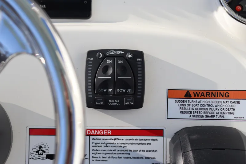 Slide: The Image of Control panel of a 2024 Pathfinder 2500 Hybrid boat with warning labels. - 35
