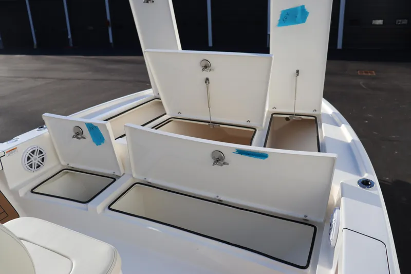 Slide: The Image of 2024 Pathfinder 2500 Hybrid boat with open storage compartments. - 39