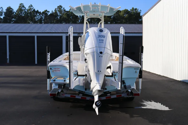Slide: The Image of 2024 Pathfinder 2500 Hybrid boat with 300 HP engine, rear view in storage area. - 4