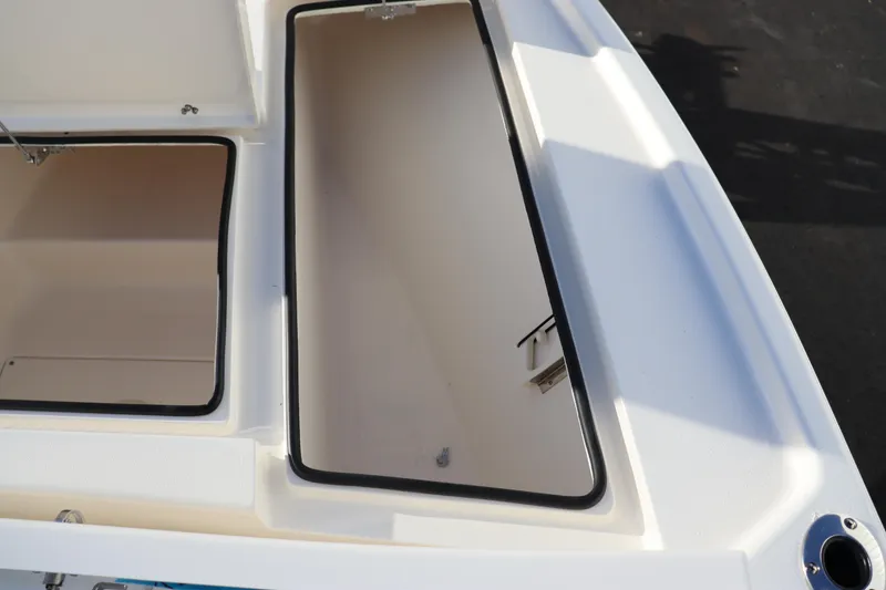 Slide: The Image of Open storage compartments on a 2024 Pathfinder 2500 Hybrid boat. - 41