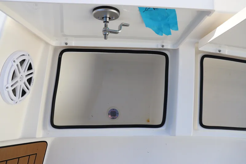 Slide: The Image of 2024 Pathfinder 2500 Hybrid boat sink and storage compartments. - 44