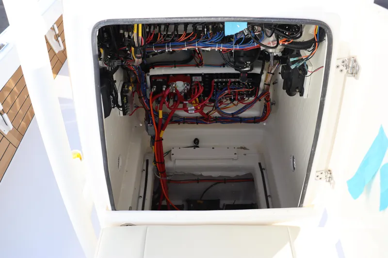 Slide: The Image of 2024 Pathfinder 2500 Hybrid boat electrical compartment with wiring and components. - 47