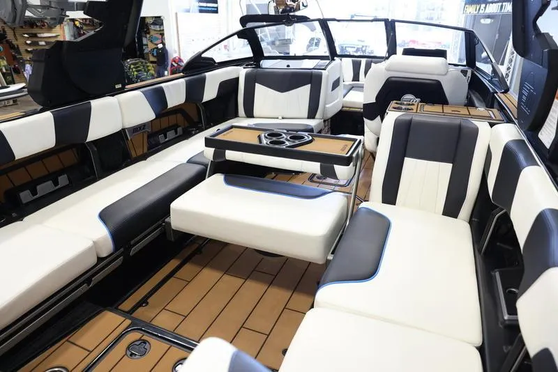 Slide: The Image of 2024 Malibu 24 MXZ boat interior with luxurious seating and modern design. - 20