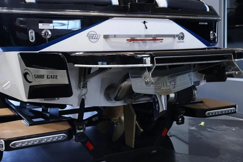 Slide: The Image of 2024 Malibu 24 MXZ boat rear view with Surf Gate technology. - 5