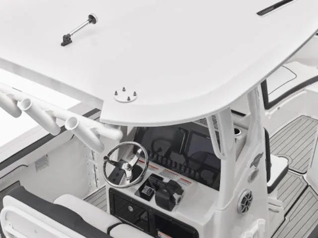Slide: The Image of 2024 Yamaha Boats 255 FSH Sport E helm station with steering wheel and controls. - 13