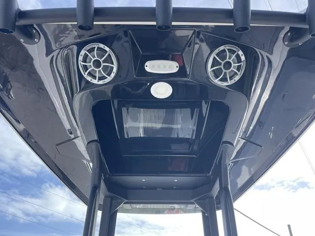 Slide: The Image of 2024 Yamaha Boats 252SD bow seating area with teak-style decking. - 13