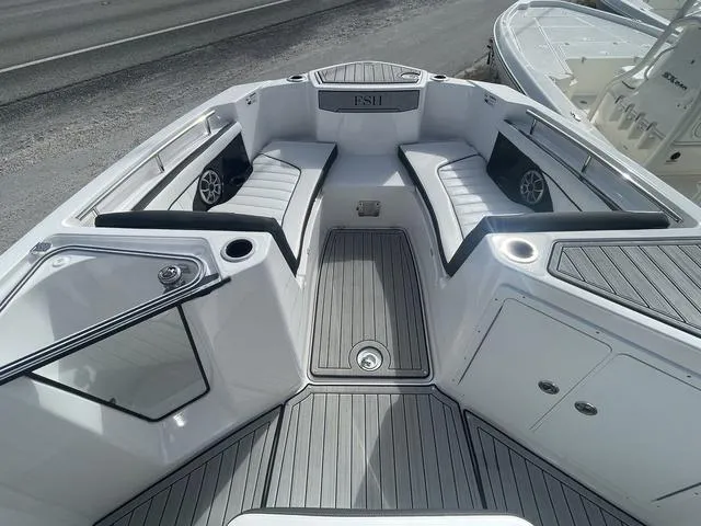 Slide: The Image of 2024 Yamaha Boats 252SD interior with tan seating and modern design. - 15