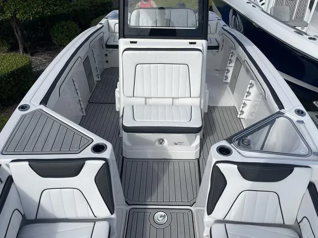 Slide: The Image of 2024 Yamaha Boats 255 FSH Sport H interior with sleek seating and modern design. - 21