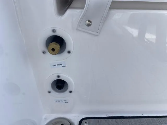 Slide: The Image of 2024 Yamaha Boats 255 FSH Sport H water inlets for raw and fresh water. - 24