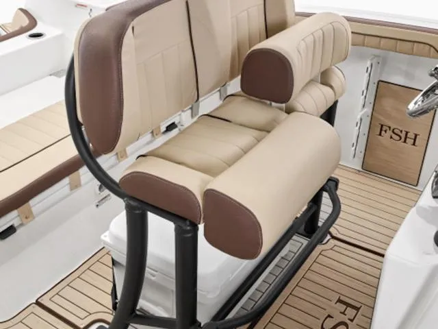 Slide: The Image of 2024 Yamaha Boats 255 FSH Sport H interior with cushioned seating and FSH branding. - 33
