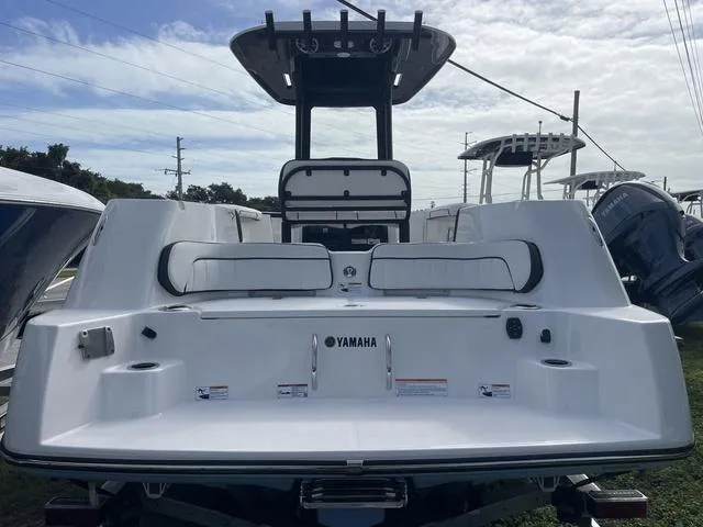 Slide: The Image of Close-up of 2024 Yamaha Boats 252SD control panel and cup holder. - 4