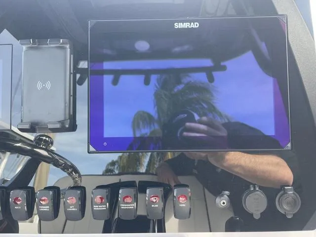 Slide: The Image of 2024 Yamaha Boats 252SD interior with brown seating and white deck. - 9