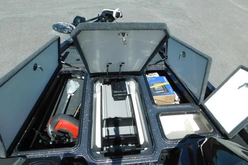 Slide: The Image of 2024 Ranger Z519 boat storage compartments open, showcasing organized interior space. - 14