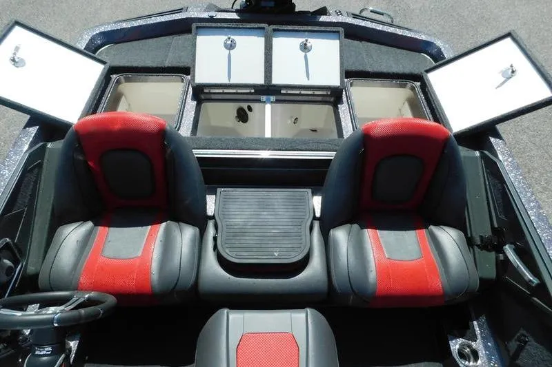 Slide: The Image of 2024 Ranger Z519 boat interior with red and black seats, open storage compartments. - 8