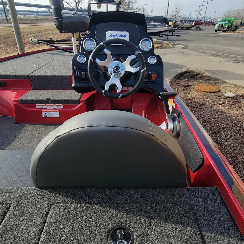 Slide: The Image of 2024 Nitro Z17 boat cockpit with steering wheel and Lowrance electronics. - 2