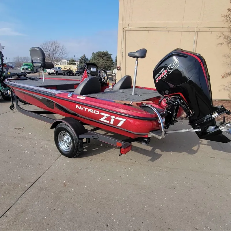 Slide: The Image of 2024 Nitro Z17 boat with trailer and outboard motor. - 6