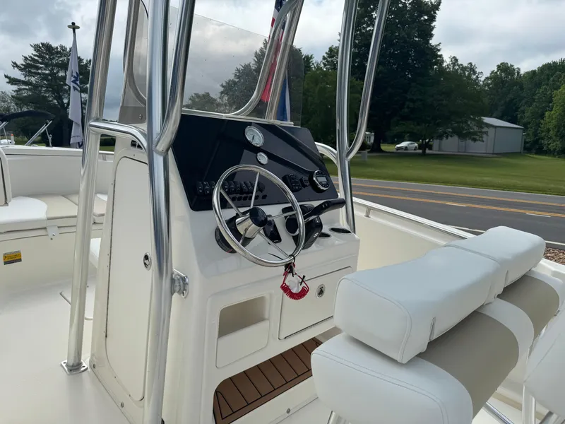 Slide: The Image of 2026 Bulls Bay 230 CC boat console with rod holders and cooler. - 8