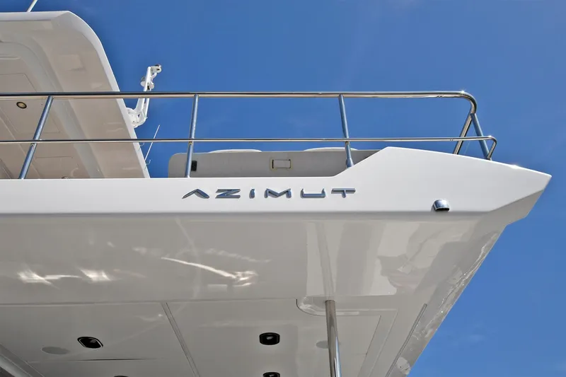 Slide: The Image of 2022 Azimut 72 FLY yacht exterior detail against blue sky. - 12