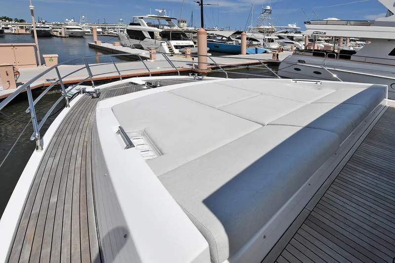 Slide: The Image of Azimut 72 FLY 2022 yacht with spacious sunbathing area at marina. - 17