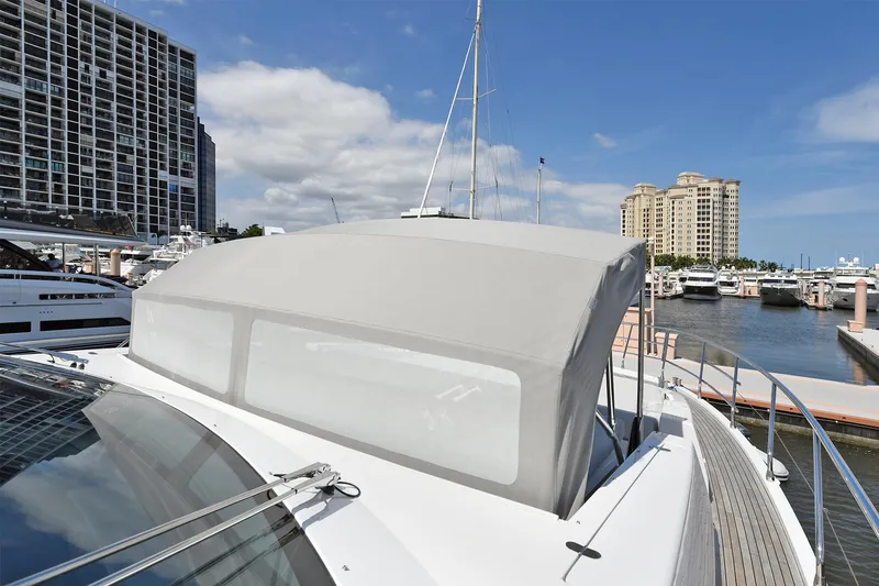 Slide: The Image of Azimut 72 FLY 2022 yacht docked at marina with cityscape background. - 22