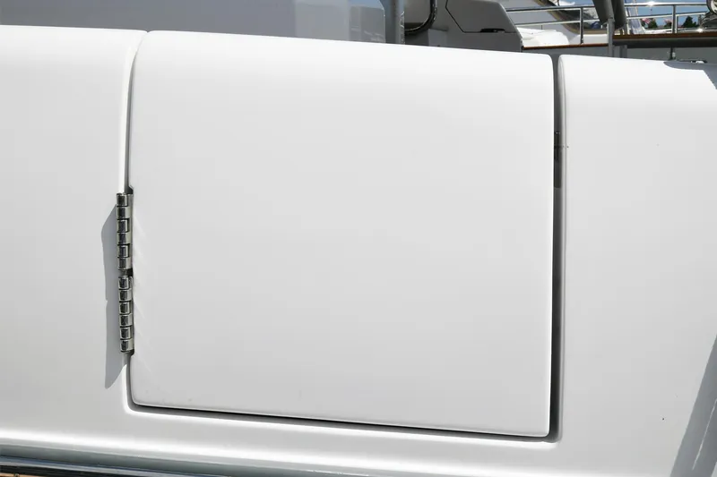 Slide: The Image of Close-up of the 2022 Azimut 72 FLY yacht's sleek white exterior panel. - 26