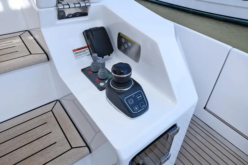 Slide: The Image of Control panel of a 2022 Azimut 72 FLY yacht with joystick and navigation controls. - 28