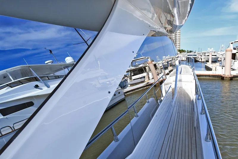 Slide: The Image of Side view of 2022 Azimut 72 FLY yacht docked at marina. - 29