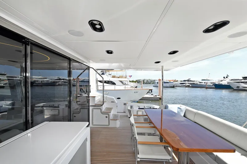 Slide: The Image of Luxury deck of 2022 Azimut 72 FLY yacht with marina view. - 36