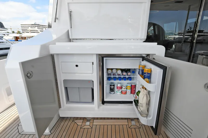 Slide: The Image of Outdoor kitchenette on 2022 Azimut 72 FLY yacht with mini fridge and storage. - 38