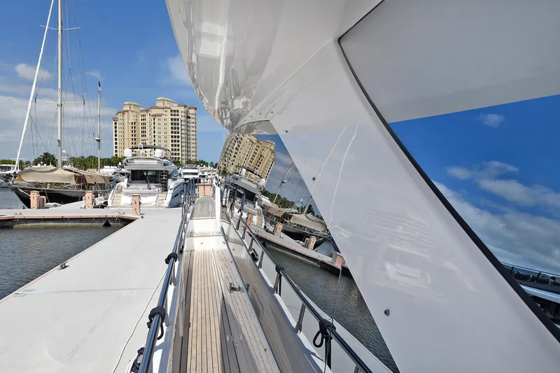 Slide: The Image of Azimut 72 FLY 2022 yacht docked at a marina with cityscape background. - 39