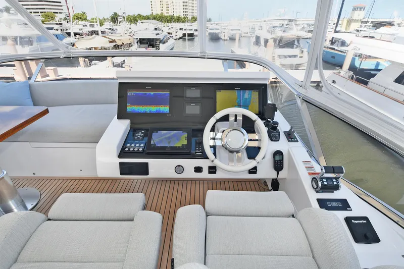 Slide: The Image of Flybridge helm station of 2022 Azimut 72 FLY yacht with modern navigation equipment. - 47