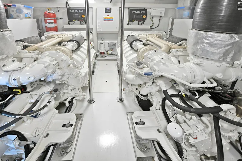 Slide: The Image of Engine room of 2022 Azimut 72 FLY yacht, featuring dual MAN engines. - 5