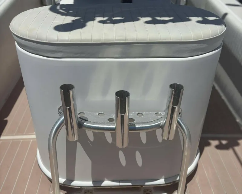 Slide: The Image of 2009 Andros Tarpon 26 boat with rod holders and cushioned seating. - 16