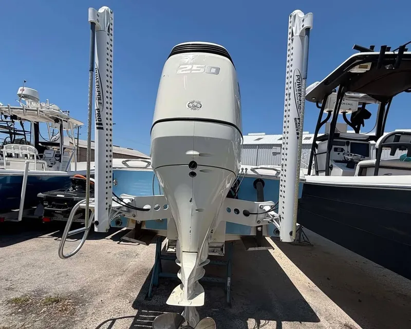 Slide: The Image of 2009 Andros Tarpon 26 boat with powerful outboard motor, docked in a marina. - 20