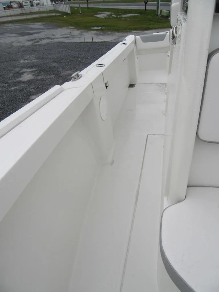Slide: The Image of 2024 Parker 2200 Center Console boat interior, white deck and seating. - 10