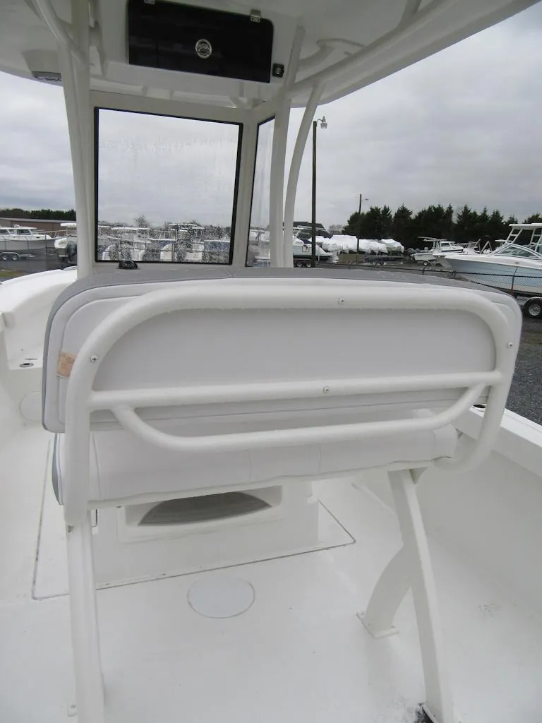 Slide: The Image of 2024 Parker 2200 Center Console boat interior with white seating and console. - 14