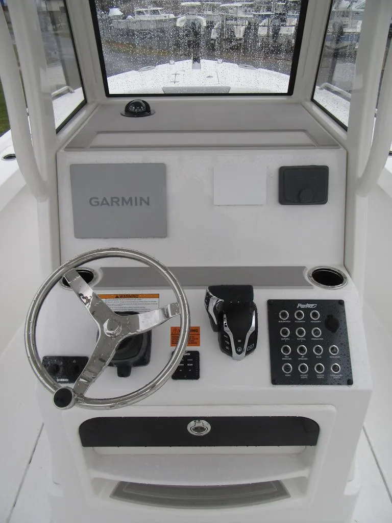 Slide: The Image of 2024 Parker 2200 Center Console boat dashboard with Garmin navigation system. - 16