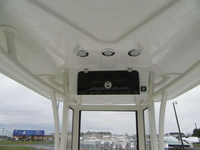 Slide: The Image of 2024 Parker 2200 Center Console boat interior roof with lights. - 2