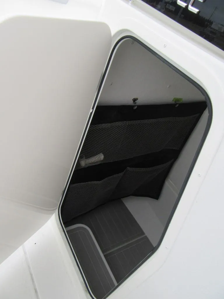 Slide: The Image of Storage compartment of 2024 Parker 2200 Center Console boat. - 9