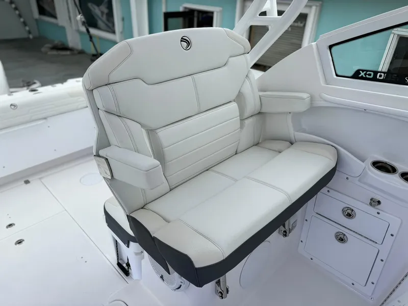 Slide: The Image of Luxurious seating on the 2024 Edgewater 280cx boat, featuring premium white upholstery. - 20