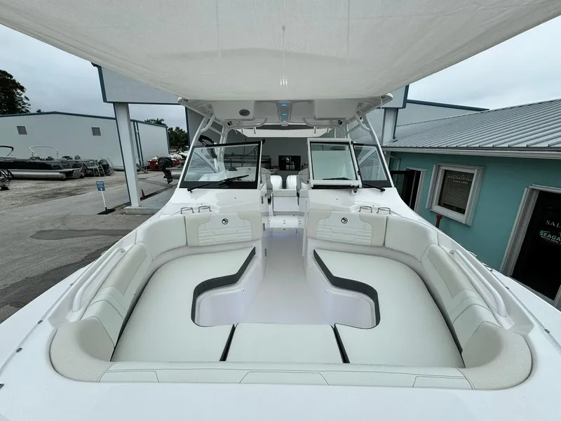 Slide: The Image of 2024 Edgewater 280cx boat with spacious seating and modern design. - 31