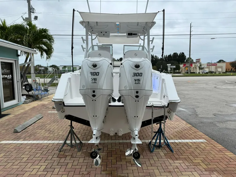 Slide: The Image of 2024 Edgewater 280cx boat with twin 300 V6 outboard engines on display. - 7