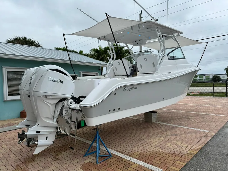 Slide: The Image of 2024 Edgewater 280cx boat with Yamaha outboard engines on display. - 8