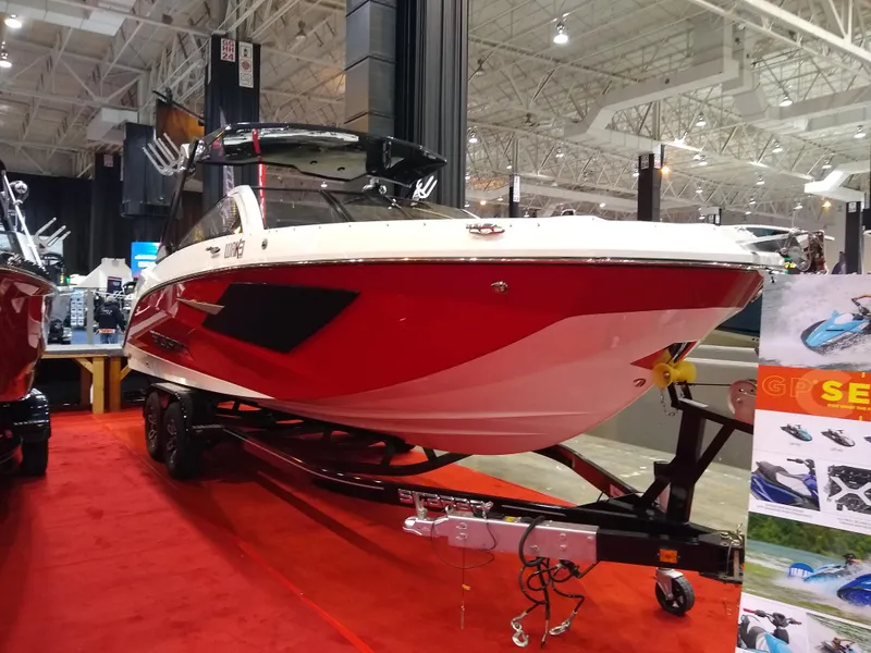 Slide: The Image of 2024 Scarab 285 Wake ID boat on display at an indoor boat show. - 2