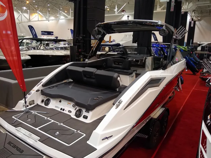 Slide: The Image of 2024 Scarab 285 Wake ID boat on display at a boat show. - 3