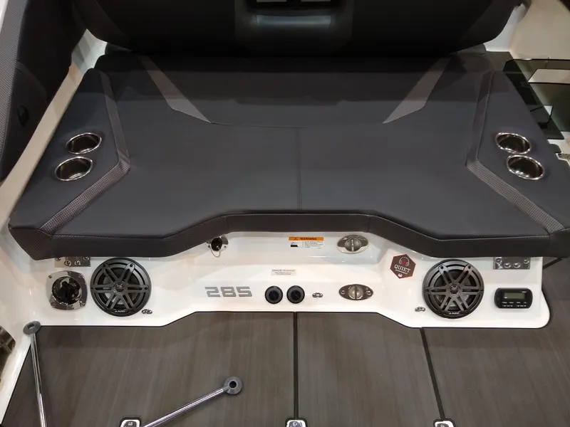 Slide: The Image of 2024 Scarab 285 Wake ID boat rear deck with speakers and cup holders. - 8