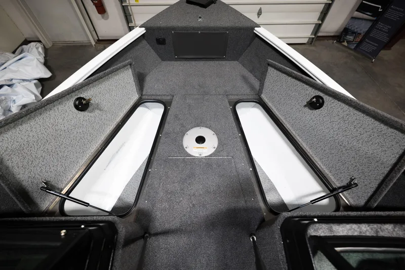 Slide: The Image of 2024 Lund 1675 Adventure Sport boat interior with storage compartments. - 11